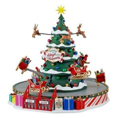 a christmas tree with santa's sleigh and reindeers on it in front of a white background