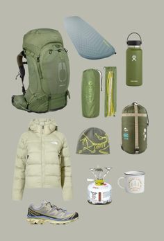 the contents of a pack including backpack, water bottle and other items are arranged on a gray background