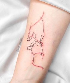 a woman's arm with a red line drawing on it