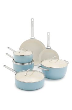 a set of blue pots and pans on a white background