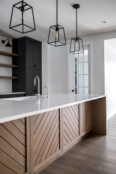 a kitchen with white counter tops and wooden cabinets