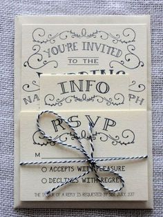 an old fashioned wedding card with a ribbon tied around the front and back of it