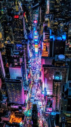 an aerial view of new york city at night from the top of the empire building