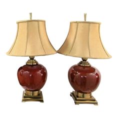 pair of red ceramic lamps with gold bases