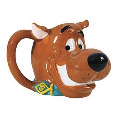 a ceramic mug with a dog's head on it