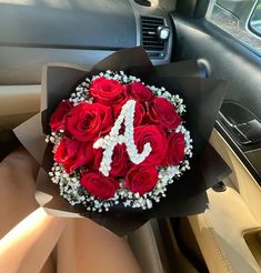 a bouquet of roses in the back seat of a car