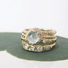 Handcrafted ring. This Aquamarine finds a peaceful home surrounded by individually hand-sculpted 14K gold and a twinkling strip of diamonds. Wedding Jewelry With Rose Cut Diamonds And Aquamarine, Gold Aquamarine Ring, Aquamarine Ring Vintage, Beach Cove, Peaceful Home, Jewels Rings, Bezel Ring, Aquamarine Ring, Gemstone Engagement