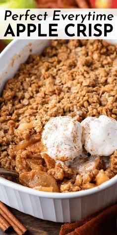 an apple crisp in a white dish with two scoops on top and cinnamon sticks next to it