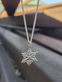 ❄️In stock and can ship immediately!❄️  Be as unique as a snowflake with this wintery necklace! This sweet sterling silver snowflake pendant is absolutely lovely.  Available with and without a sterling silver 18-inch 1.2 mm French rope chain. This is a part of our snowflake collection- check out our coordinating stud and dangle earrings too! Snowflake Necklace Silver, Sterling Silver Snowflake Jewelry For Winter, Silver Snowflake Jewelry For Holidays, Sterling Silver Snowflake Jewelry, Winter Snowflake Necklace, Sterling Silver Snowflake Necklace In White Gold, White Gold Sterling Silver Snowflake Necklace, White Gold Snowflake Necklace In Sterling Silver, White Gold Snowflake Necklace