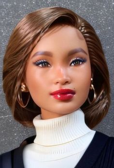 a close up of a doll wearing a white turtle neck sweater and gold hoop earrings