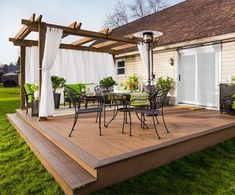 a patio with table and chairs on it