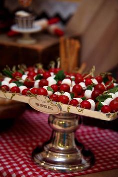 there are cherries and marshmallows in the tray on the table top