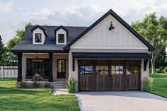 a two car garage is shown in front of a house