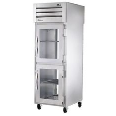 an empty stainless steel refrigerator on wheels