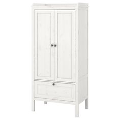 a white armoire with two drawers