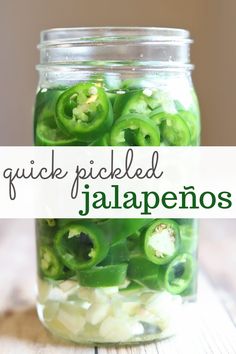 pickled jalapenos in a mason jar with the words quick pickled jalapenos