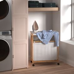 a washer and dryer sitting next to each other in a room