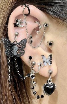 a woman with ear piercings and jewelry on her ears