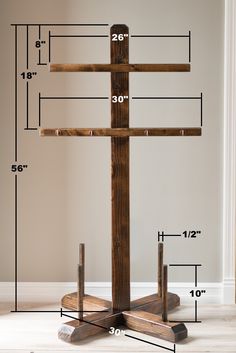 a wooden cross is shown with measurements for it