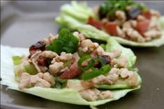 two lettuce cups filled with meat and vegetables