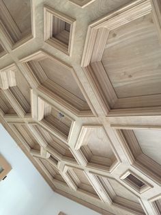 the ceiling is made up of wooden hexagonals