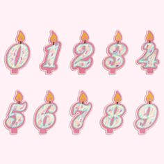 a set of eight birthday candles with the number six on each candle and one burning