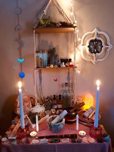 a table with candles and other items on it