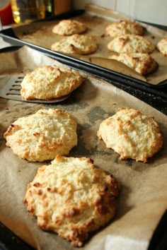 some biscuits are sitting on the baking sheet