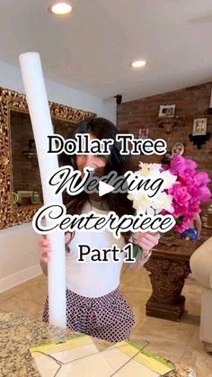 a woman holding a large white pole with flowers on it and the words dollar tree wedding centerpiece part 1