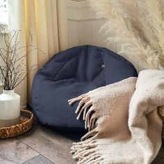 a blue bean bag sitting on top of a wooden floor