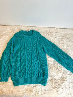 "gorgeous handmade knit sweater from the 90s. total cozy comfy hygge vibes. perfect for layering under a trench to pop to the coffee shop for a latte and podcast sesh. we love that lush cable knit fabric in a fun and unique teal color.  masterfully handmade in 1999. thank you barbara! this is such an outstanding piece. excellent vintage condition. MEASUREMENTS (taken flat): Bust: 20 - 32\" stretched Waist: 20 - 32\" stretched Hip: 16 - 28\" stretched  Shoulders: 23.5\" Length: 30\"" Teal Vintage Sweater, Hygge Vibes, Plus Size 90s, Sweater Handmade, Sweater Plus Size, Sweater Plus, Vintage Plus Size, Teal Sweater, Handmade Knit