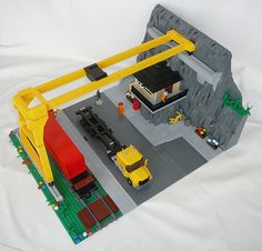 a lego construction site with trucks and cars