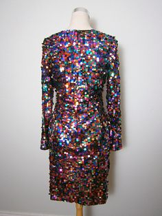 "This is a BOLD and FUN little dress from Oleg Cassini Black Tie. It's fully embellished with multicolored paillette sequins and is in perfect condition! Note, there's some stretch in the material. Bust - 36-40\" Waist - 28-32\" Hips - 38-42\" Length - 37\" Tag Size - 10 This dress comes from a pet-free and smoke-free home. If you would like more info or have any questions, please don't hesitate to ask!" Elegant Multicolor Sequin Cocktail Dress, Disco Style Embellished Sequin Cocktail Dress, Embellished Multicolor Evening Dress, Multicolor Embellished Evening Dress, Glamorous Sequined Dress For Carnival, Glamorous Multicolor Sequin Cocktail Dress, Elegant Multicolor Sequin Dress For Party Season, Elegant Multicolor Contrast Sequin Dress, Multicolor Sequined Disco Dresses