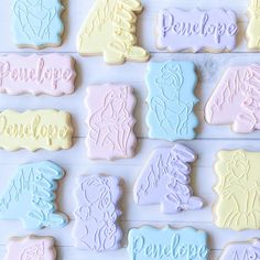 some cookies that have been decorated to look like princesses