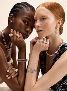 two young women are posing for the camera with their rings and bracelets in hand