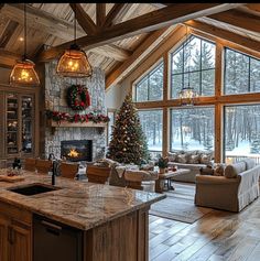 a living room filled with furniture and a fire place next to a kitchen counter top