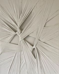 an abstract piece of art made out of white paper