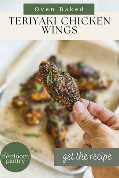 a person holding up a piece of chicken wings with the words oven baked teriyaki chicken wings get the recipe here