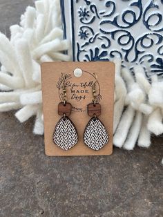 Add a bold, bohemian flair to your style with these hand-painted walnut teardrop earrings from BeYou-tifully Made Designs. Each pair features a unique geometric pattern laser-engraved into the solid walnut wood and comes in a variety of vibrant colors to suit your personal style. These earrings are meticulously handcrafted, with the teardrop shape hanging gracefully from a solid walnut square top, creating a stunning layered effect. Designed to be lightweight and comfortable, these earrings are Bohemian Brown Teardrop Earrings For Gift, Bohemian Brown Teardrop Earrings Gift, Laser Earrings Design, Laser Engraved Earrings, Bold Bohemian, Glow Forge, Laser Engraved Ideas, Earrings Ideas, Anniversary Gift For Wife