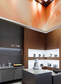 a modern kitchen is shown with stainless steel appliances