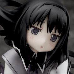 an anime character with black hair and blue eyes is posed in front of the camera