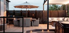 a hot tub sitting on top of a wooden deck next to an outdoor table and chairs