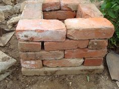 a pile of bricks sitting in the dirt