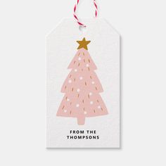 a pink christmas tree gift tag with the words, from the thomass on it