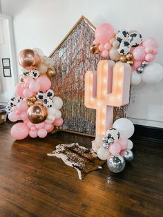 balloons and lights are arranged in the shape of letters