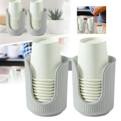 two white vases sitting next to each other