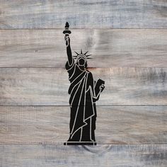 the statue of liberty painted on wooden planks is shown in black and white colors