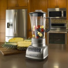 A KitchenAid five-speed blender sitting on a kitchen counter. The blender is full of fruit. Kitchen Counter, Kitchen Aid, A Kitchen, Kitchen Appliances, Fruit