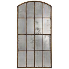 an arched window with glass panes and metal bars on the bottom, against a white wall