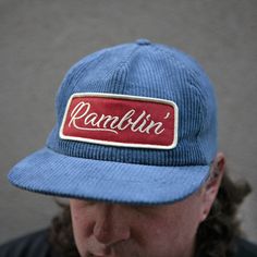 For the ramblin' man, an unstructured baseball-style adjustable cap made of smokey blue corduroy with a red and cream embroidered patch. This version is made to fit a little deeper than our other unstructured hats, which allows it to fit bigger heads. (No giant dome on your head!) Hat has an inside circumference of roughly 23-23.5 inches, but lots of flexibility with the snapback closure. Patch measures 5 inches wide. Retro Baseball Cap With Patches, Retro Adjustable Corduroy Baseball Cap, Vintage Corduroy Trucker Hat, Vintage Corduroy Snapback Baseball Cap, Vintage Corduroy Cap, Trendy Caps, Blue Corduroy, Vintage Cap, Corduroy Fabric